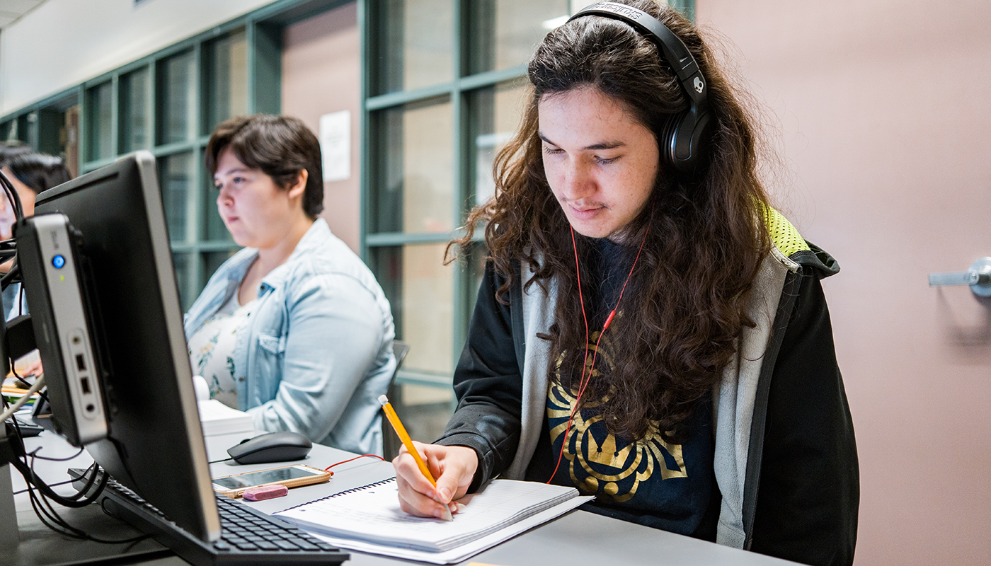 Online student working at a computer.